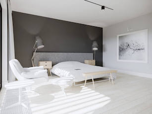Jasna minimalistyczna sypialnia z szarym łóżkiem białymi meblami i ciemną ścianą