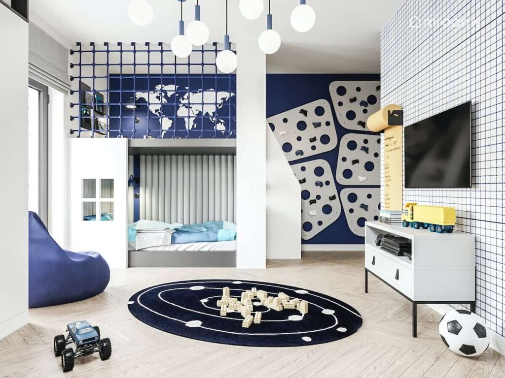 Biało granatowy pokój dla chłopca z antresolą z miejscem do zabawy i łóżkiem oraz panelami wspinaczkowymi