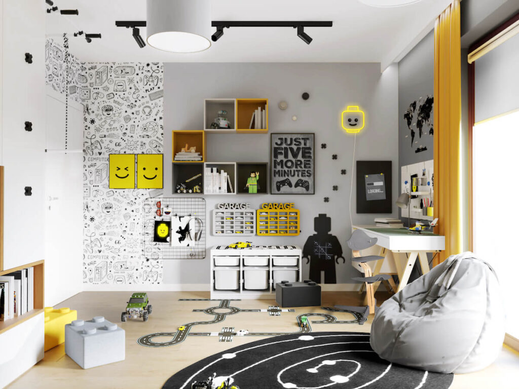Biało szary pokój dla chłopca z żółtymi akcentami w postaci ozdobnych plakatów półki na samochody szafek ściennych i kinkietu w kształcie głowy ludzika Lego