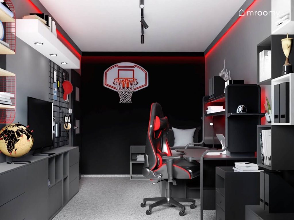 Czarno szaro biały pokój dla nastolatka a w nim ciemne meble czerwone podświetlenia oraz kosz do koszykówki