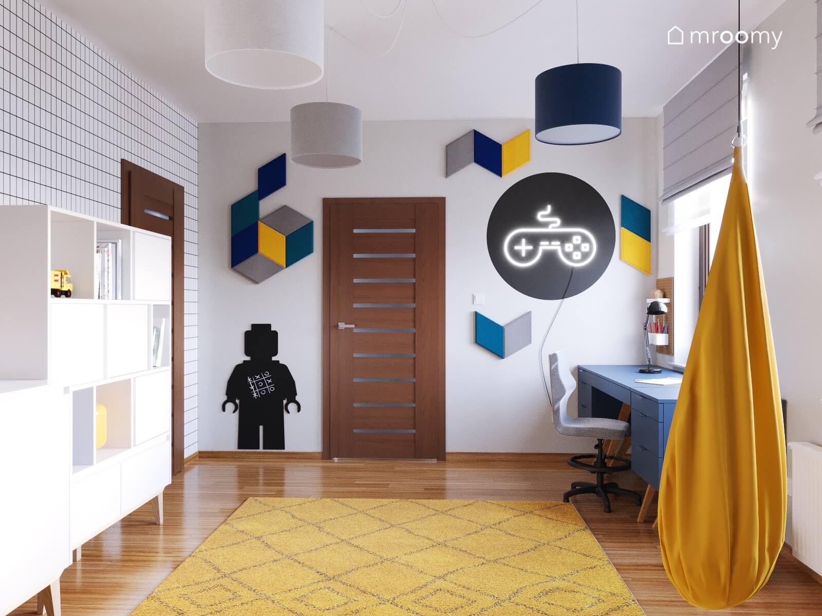 Jasny pokój dla chłopca a w nim mozaika z miękkich paneli na ścianie tapeta w kratkę i ledon w kształcie pada